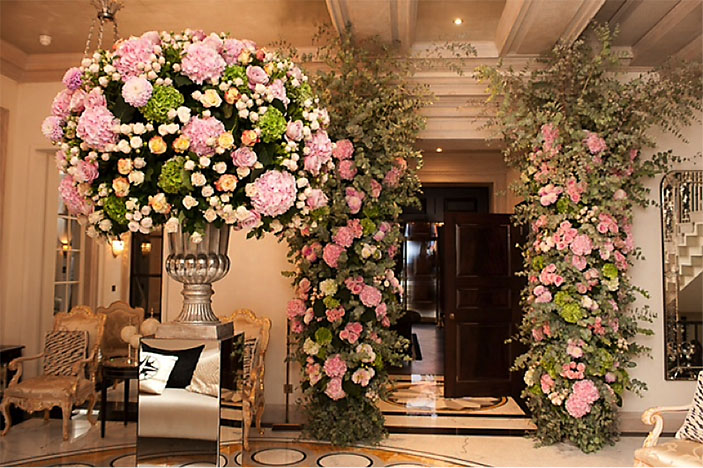 Pink wedding flowers over entrance